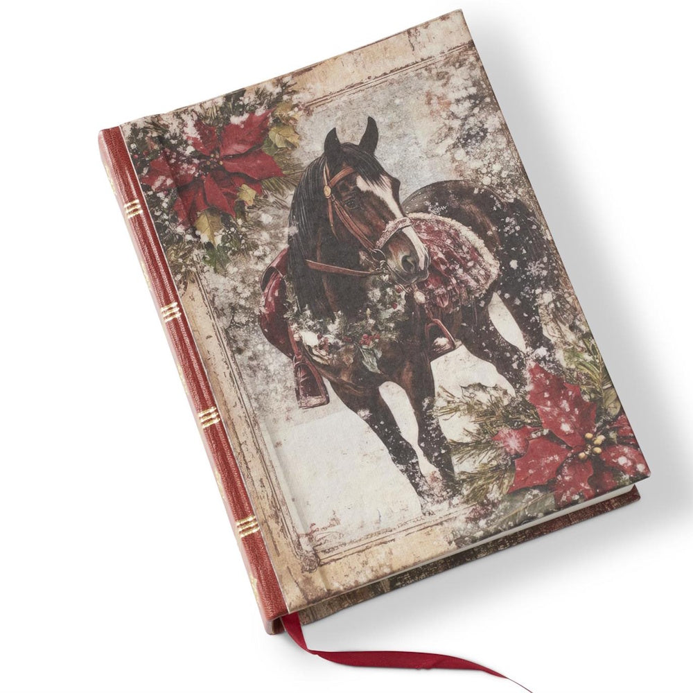 A large hardcover journal featuring a red leather spine, gold foil details, and an equestrian Christmas cover illustration.