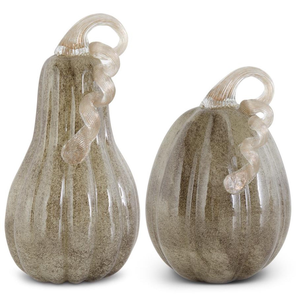 Two speckled gray-brown handblown glass decorative gourds with curled clear glass stems side by side.