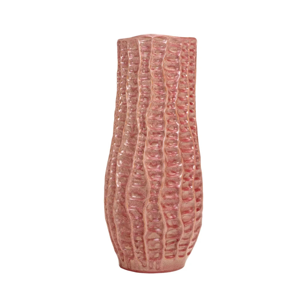 A textured pink ceramic vase with vertical wavy ridges and a slightly asymmetrical shape on a white background.