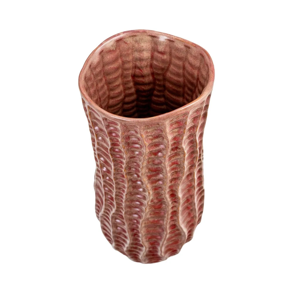 Tall, textured ceramic vase with a wavy, ribbed pattern in reddish-brown tones, viewed from a top-down angle.