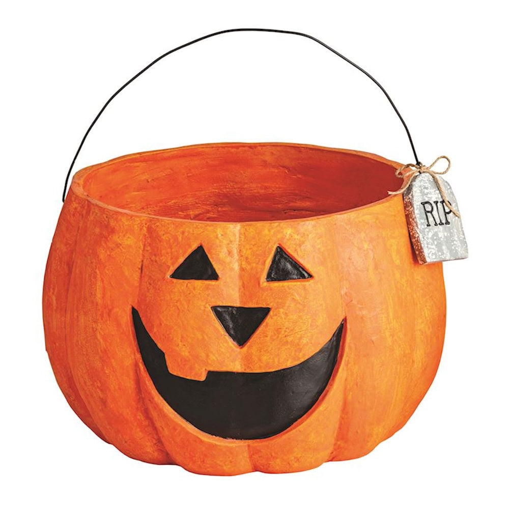 Orange paper mache Jack-o'-lantern Halloween treat bucket with a wire handle and RIP tag.