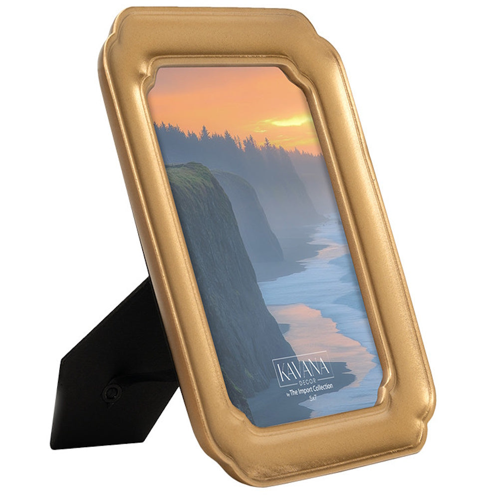 Gold Kavana Decor 5x7 picture frame with a coastal sunset photo and black easel stand back.