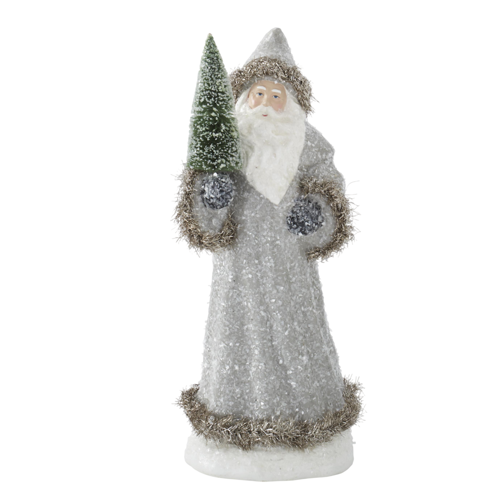 Santa figurine in a snowy gray coat trimmed with tinsel, holding a green frosted bottle brush tree.
