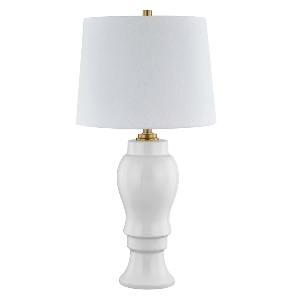 Modern white ceramic table lamp with gold accents and a white fabric drum shade for home decor.