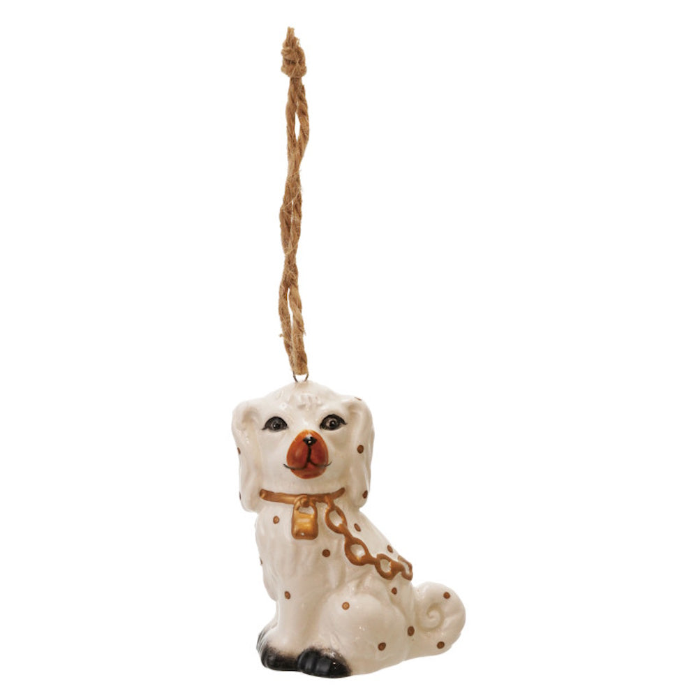 White ceramic Staffordshire dog hanging ornament with brown spots, gold collar, and twine loop.