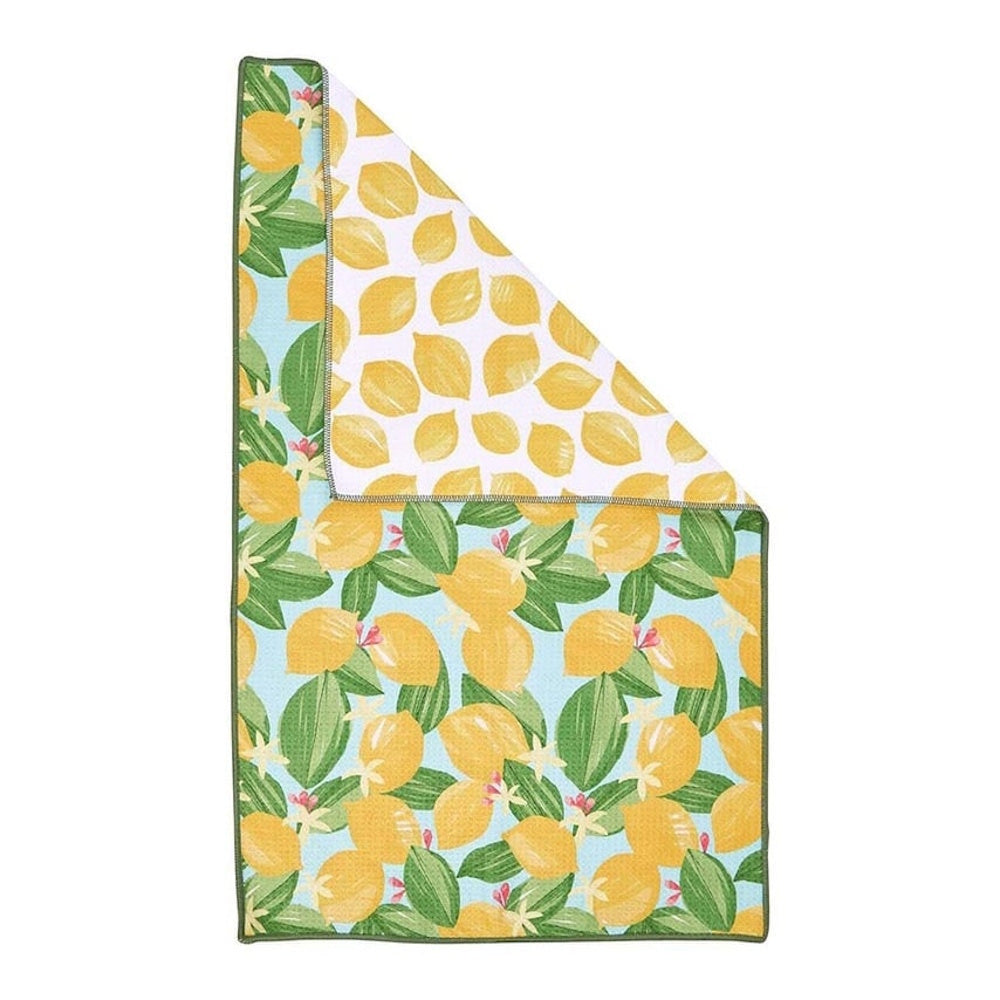 Folded tea towel featuring a lemon and blossom pattern on light blue, with a yellow lemon print on the white reverse side.