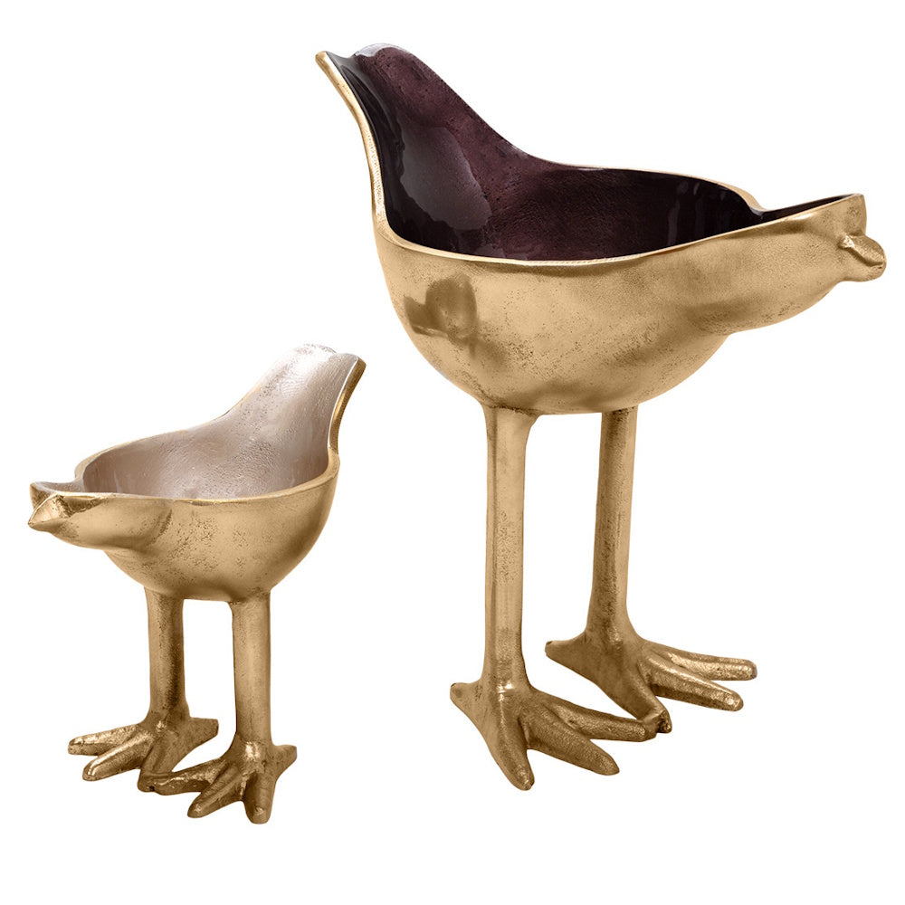 Two gold bird-shaped decorative bowls on tall legs, one large with a dark interior and one small with a silver interior.