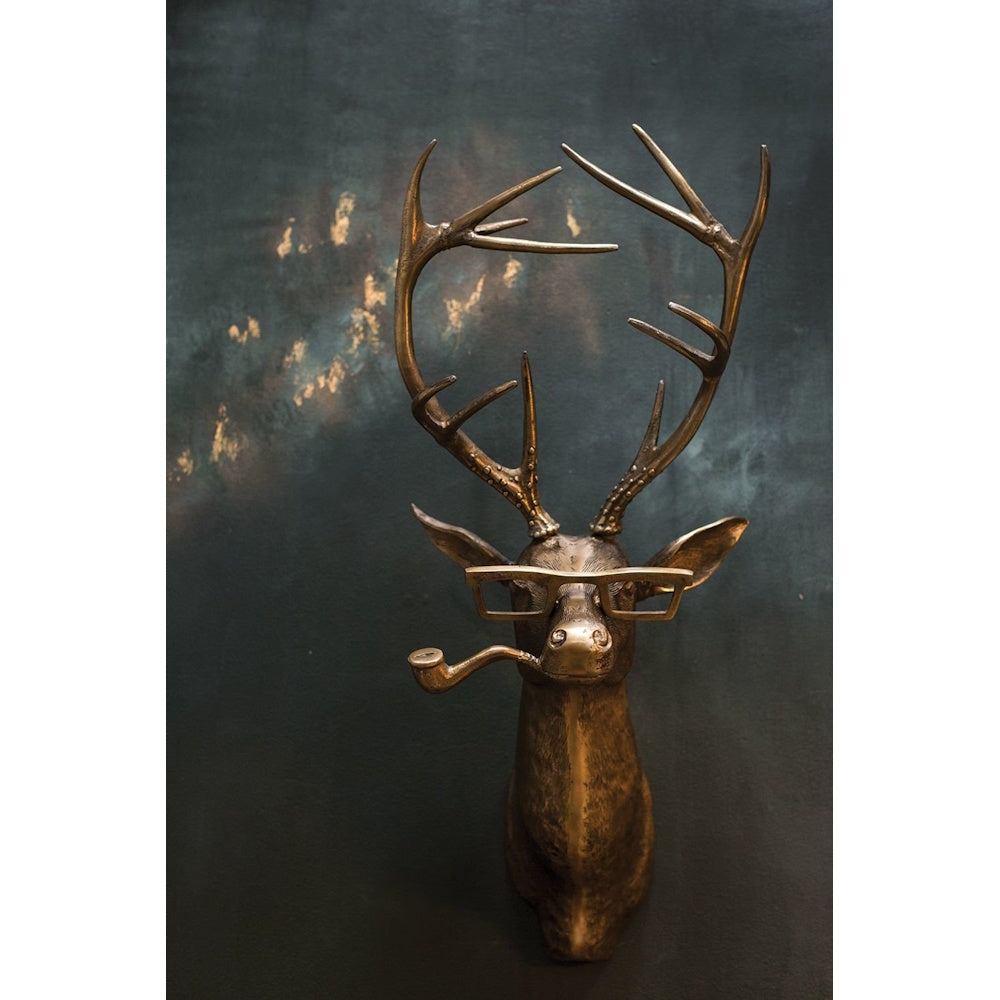 Bronze deer head wall mount with large antlers, wearing thick-rimmed glasses and holding a pipe in its mouth.