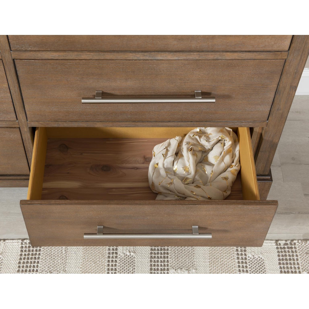 Modern wood dresser with open cedar-lined drawer and silver hardware.