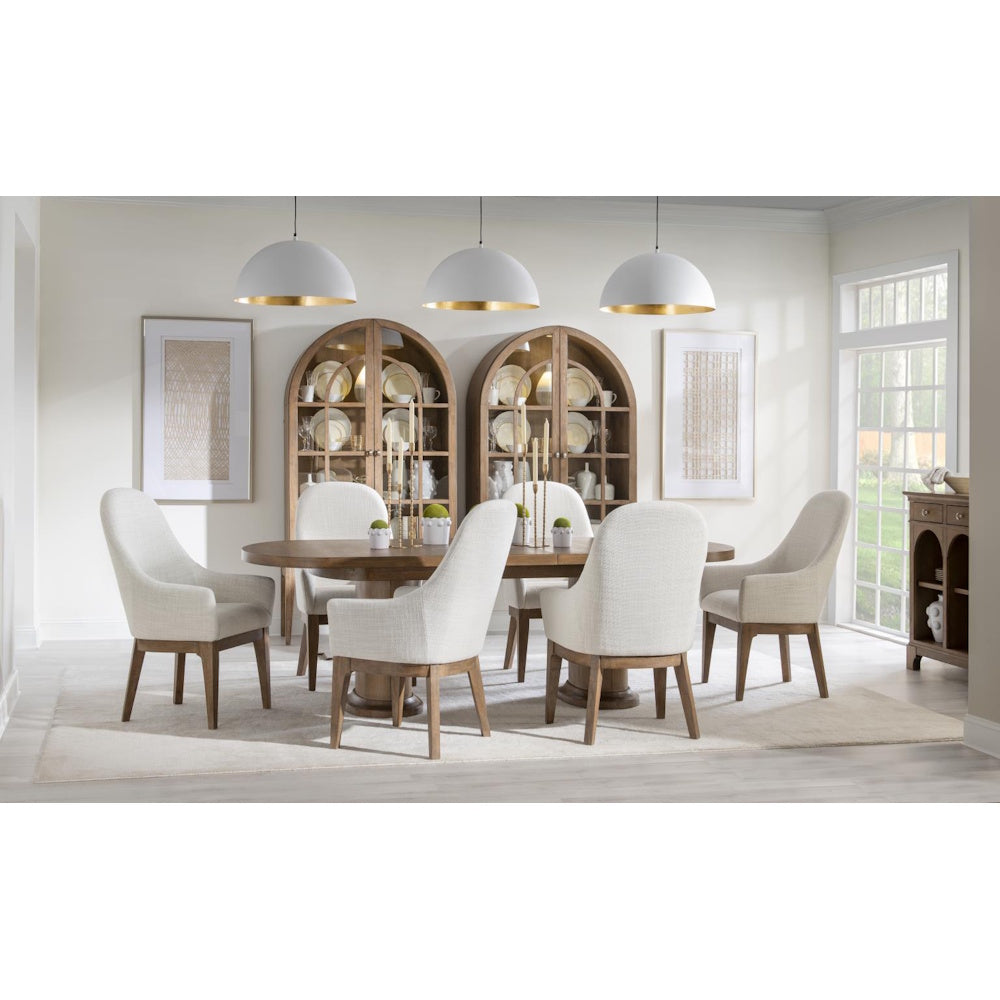 Modern wooden dining set with white upholstered chairs and arched china cabinets.
