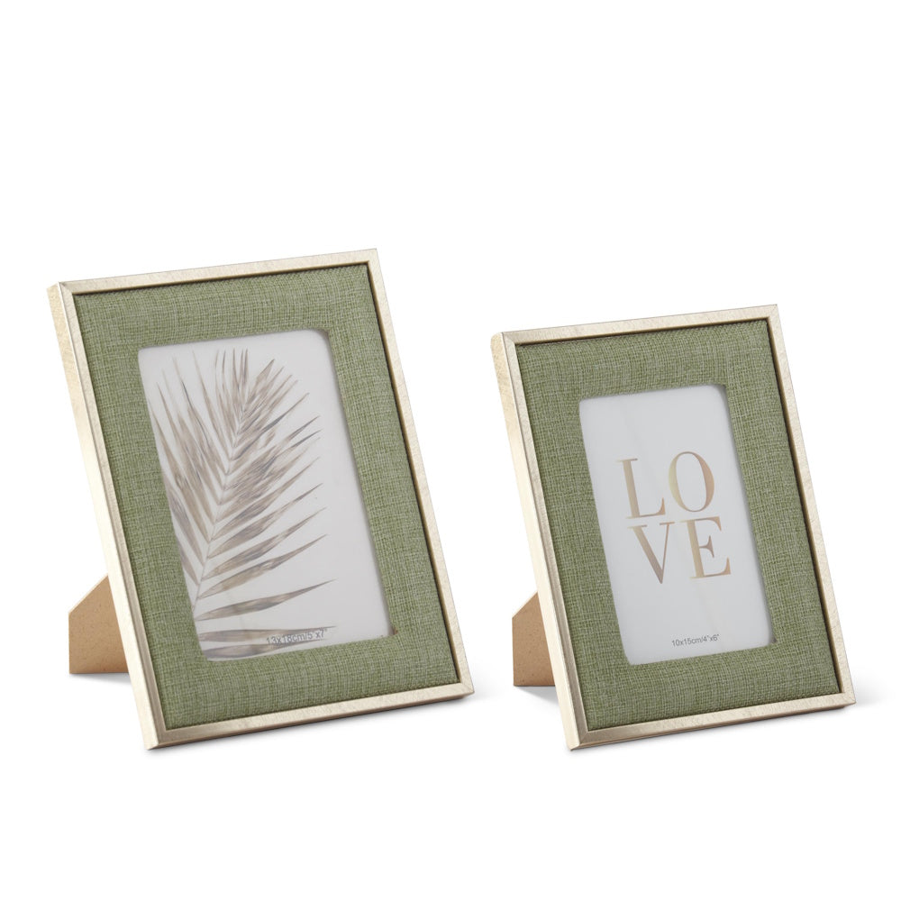 Two sage green woven linen photo frames with gold metal trim, featuring a palm leaf and "LOVE" text.
