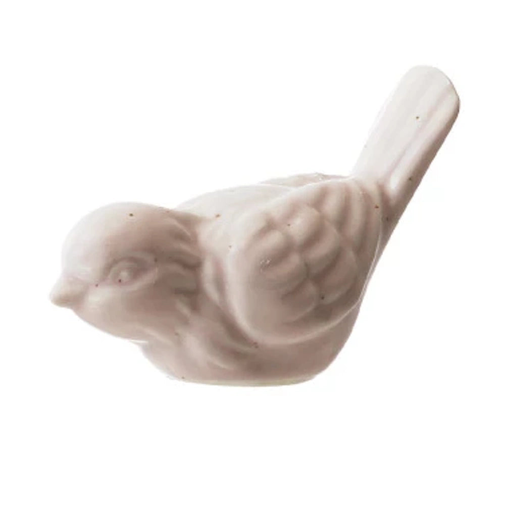 Light pink stoneware bird figurine with textured wings and tail.