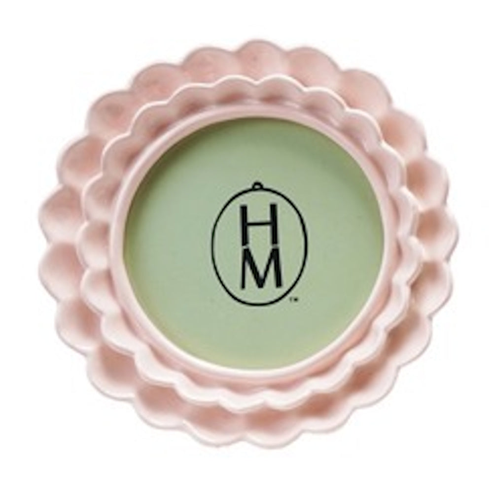 Round light pink photo frame with a double-layered ruffled border on a white background.