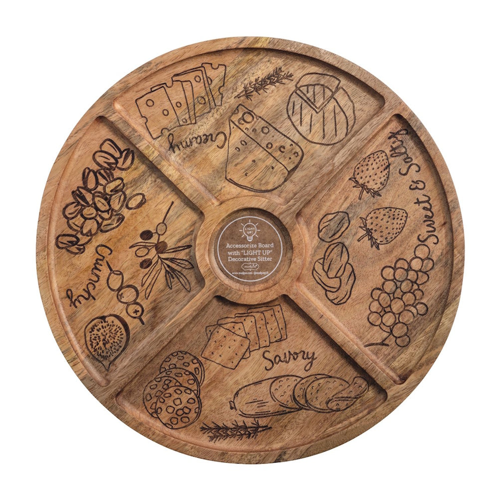 Round wooden charcuterie board with four sections labeled Creamy, Sweet & Salty, Savory, and Crunchy with food illustrations.