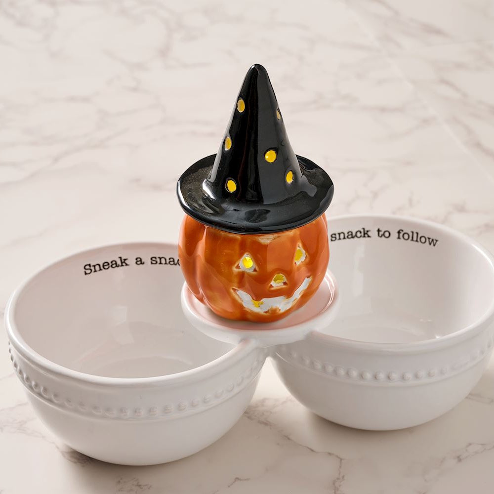Light-up ceramic witch pumpkin jack-o'-lantern Halloween double snack bowl set on a marble surface.