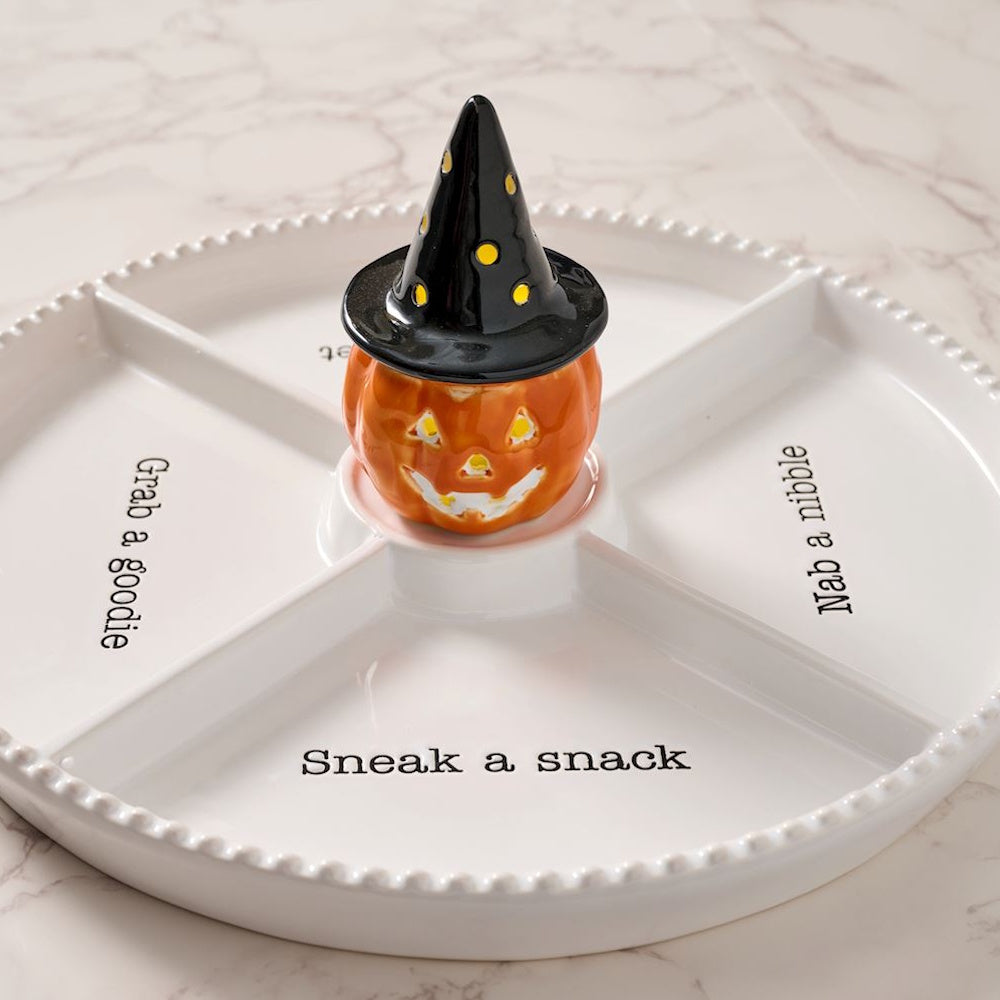 Light-up ceramic witch pumpkin sitter on a white divided Halloween snack tray with text.