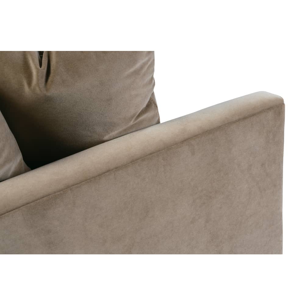 Close-up of a modern taupe velvet sofa with a sleek, slim track arm and plush matching back cushions.