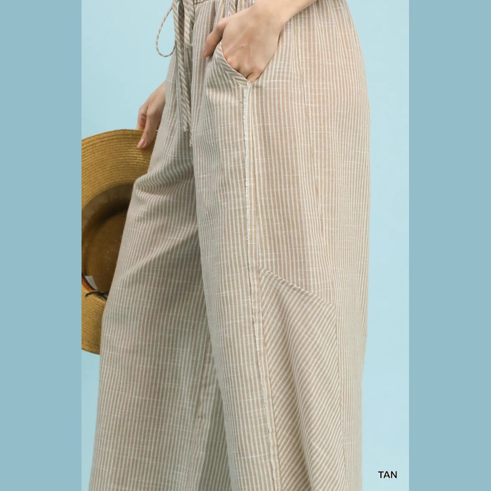 Tan striped linen-blend wide-leg pants with a drawstring waist and side pockets.