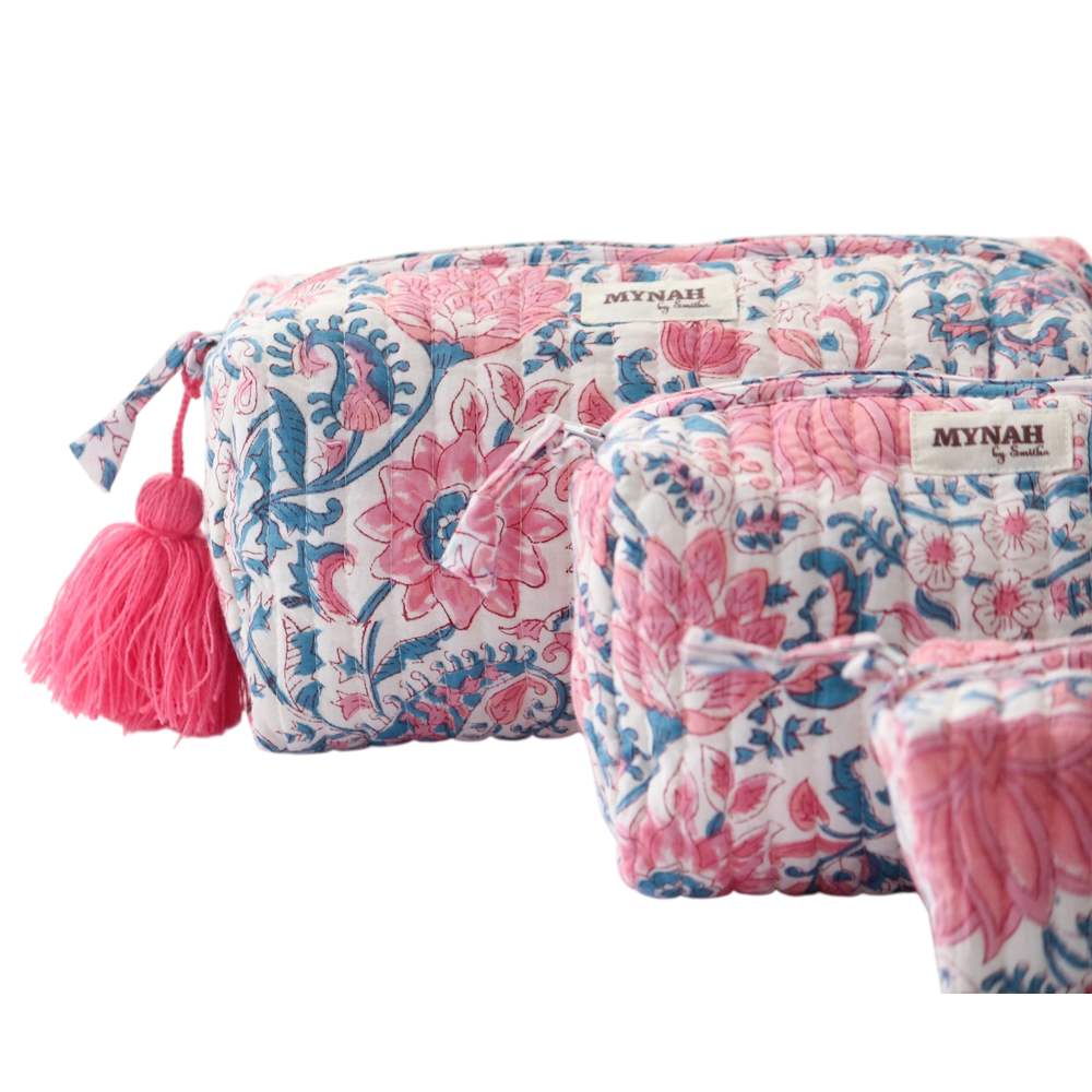 Quilted pink and blue lotus block print cosmetic pouches with a bright pink tassel zipper pull by MYNAH.