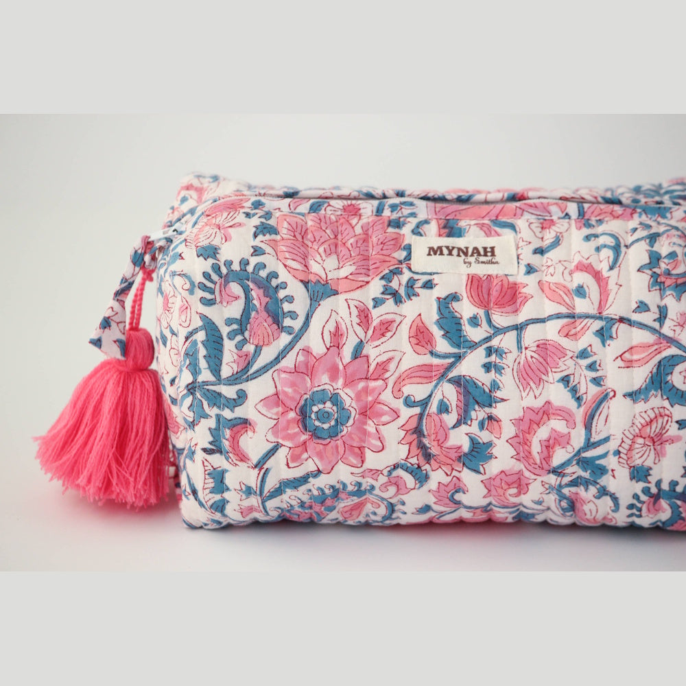 MYNAH pink and blue lotus block-print quilted zipper pouch with a bright pink tassel and floral pattern.