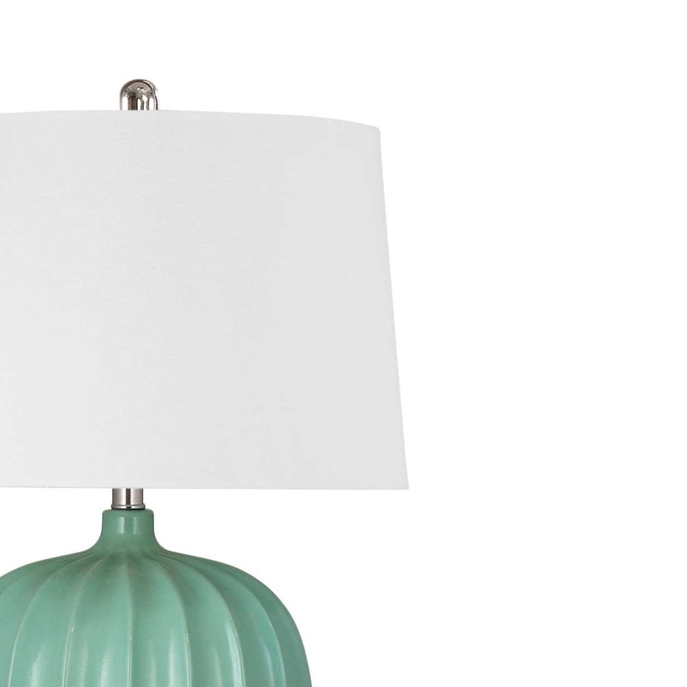 Modern ribbed seafoam green ceramic table lamp with a crisp white tapered fabric drum shade.