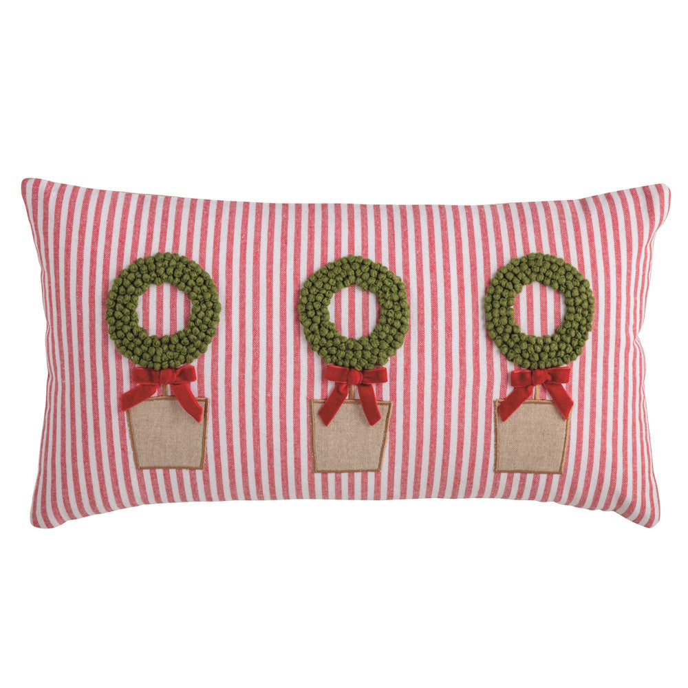 Red and white striped lumbar Christmas pillow featuring three green wreath topiary designs with red bows.