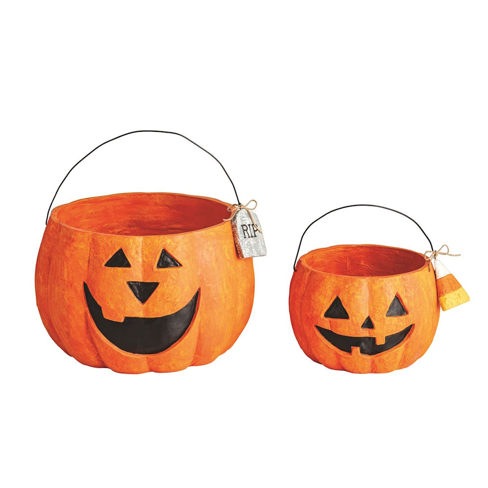 Two paper mache jack-o'-lantern Halloween treat buckets with wire handles.