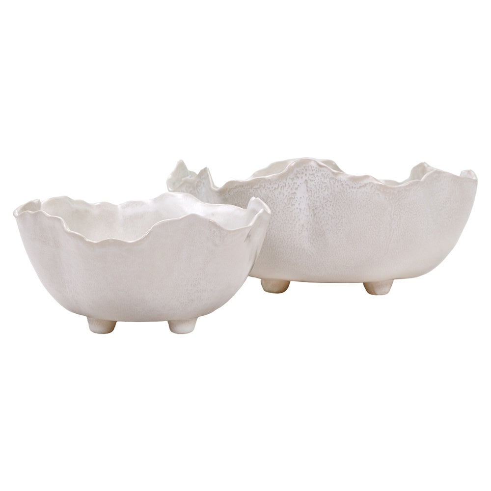 Pair of handcrafted white textured ceramic footed bowls with irregular fluted edges.