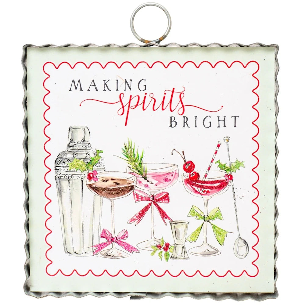 Front view of the white and red Making Spirits Bright metal art plaque featuring painted holiday cocktail illustrations.