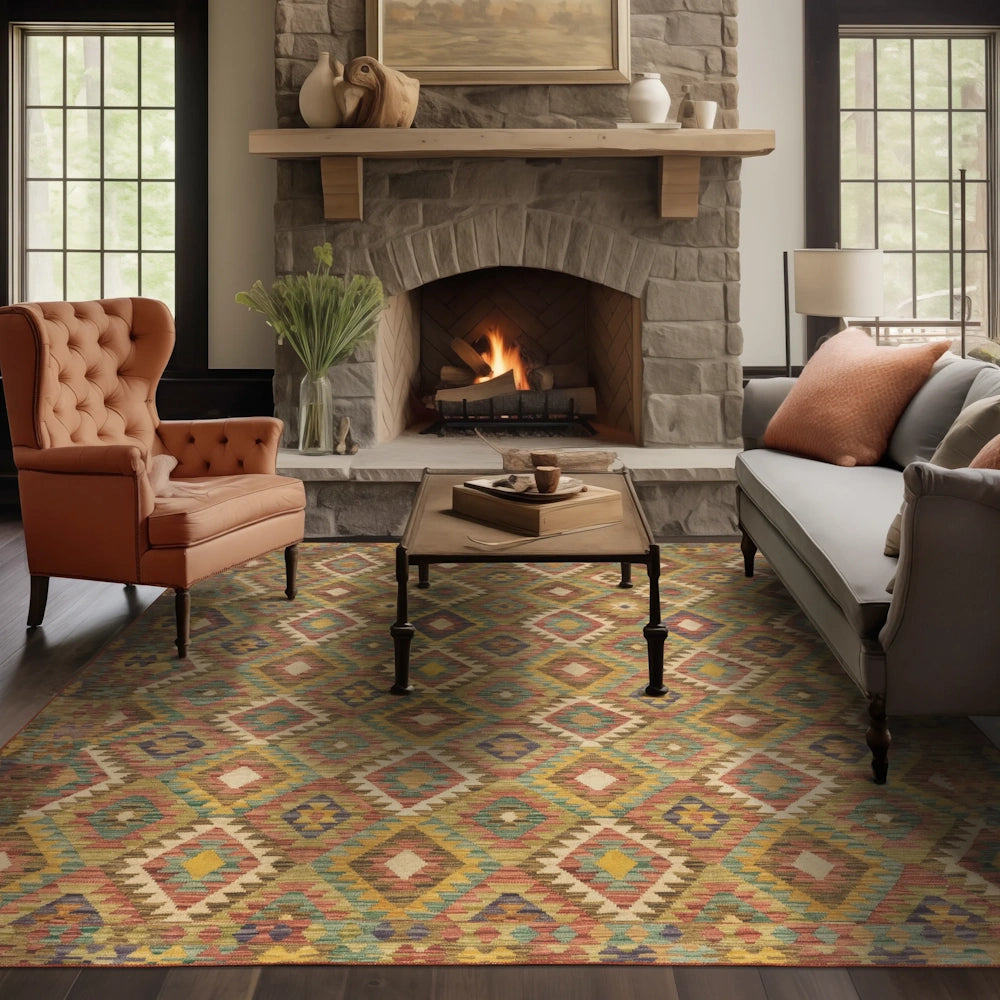 A colorful geometric area rug in a cozy living room with a stone fireplace, sofa, and armchair.