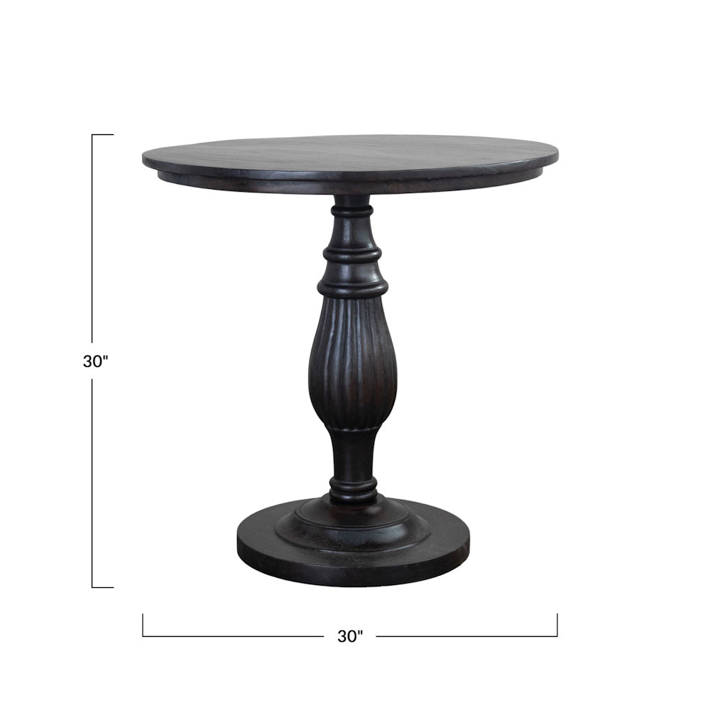 Dark wood round pedestal table with turned base, shown with 30-inch height and width dimensions.