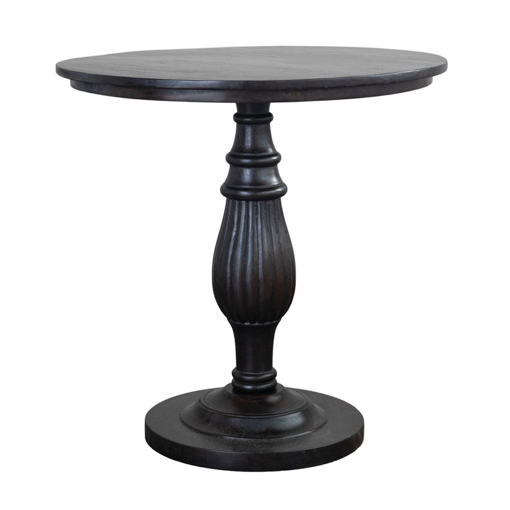 Round dark brown mango wood pedestal table with a fluted turned base.