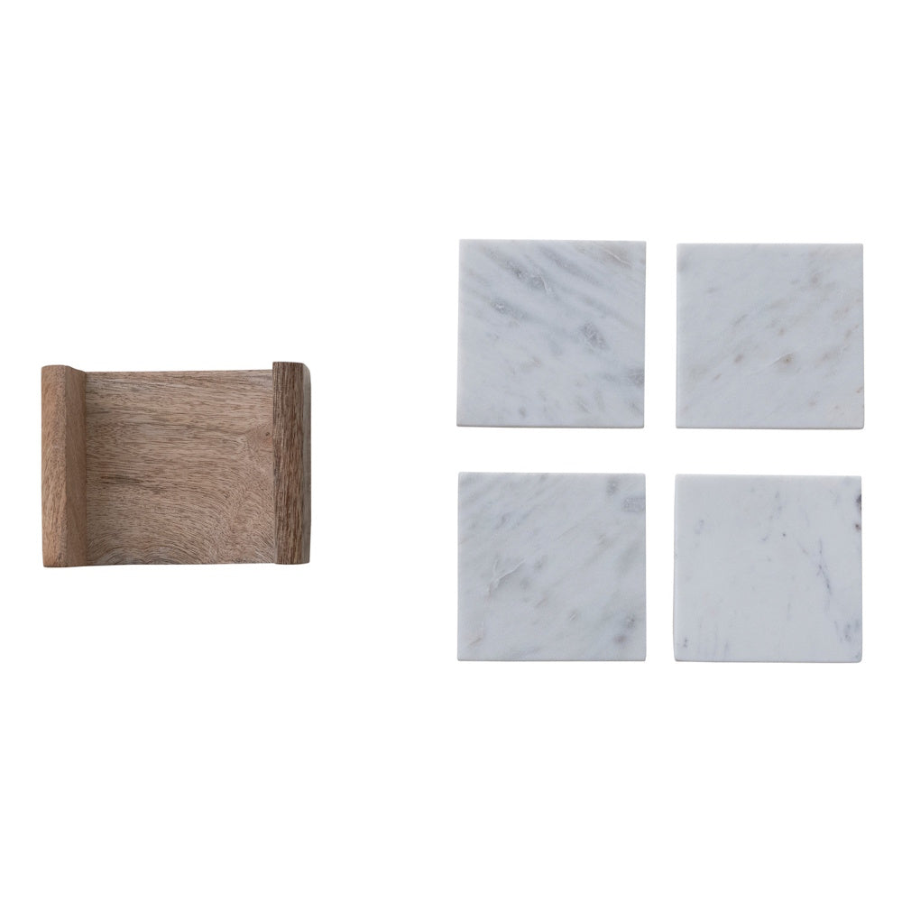 Four square white marble coasters with grey veining next to a natural mango wood holder, top view on a white background.