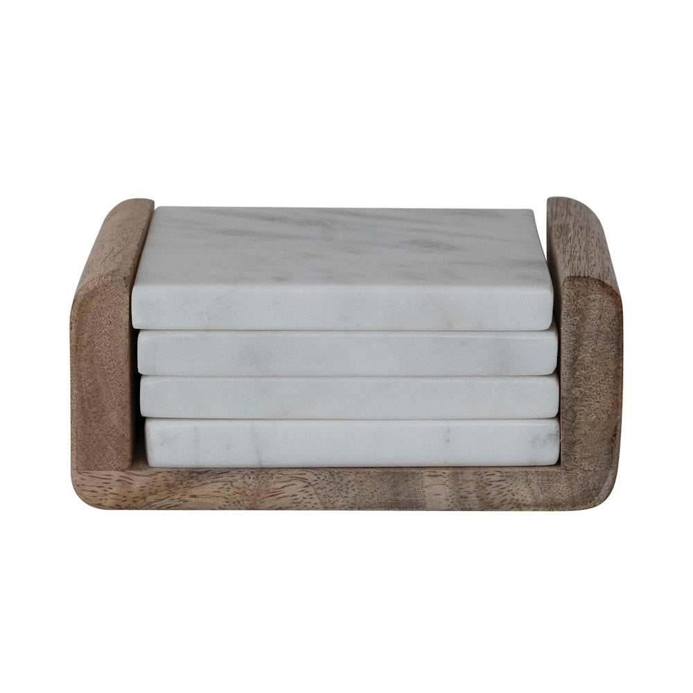 Stack of four square white marble coasters in a rustic brown mango wood holder on a white background.