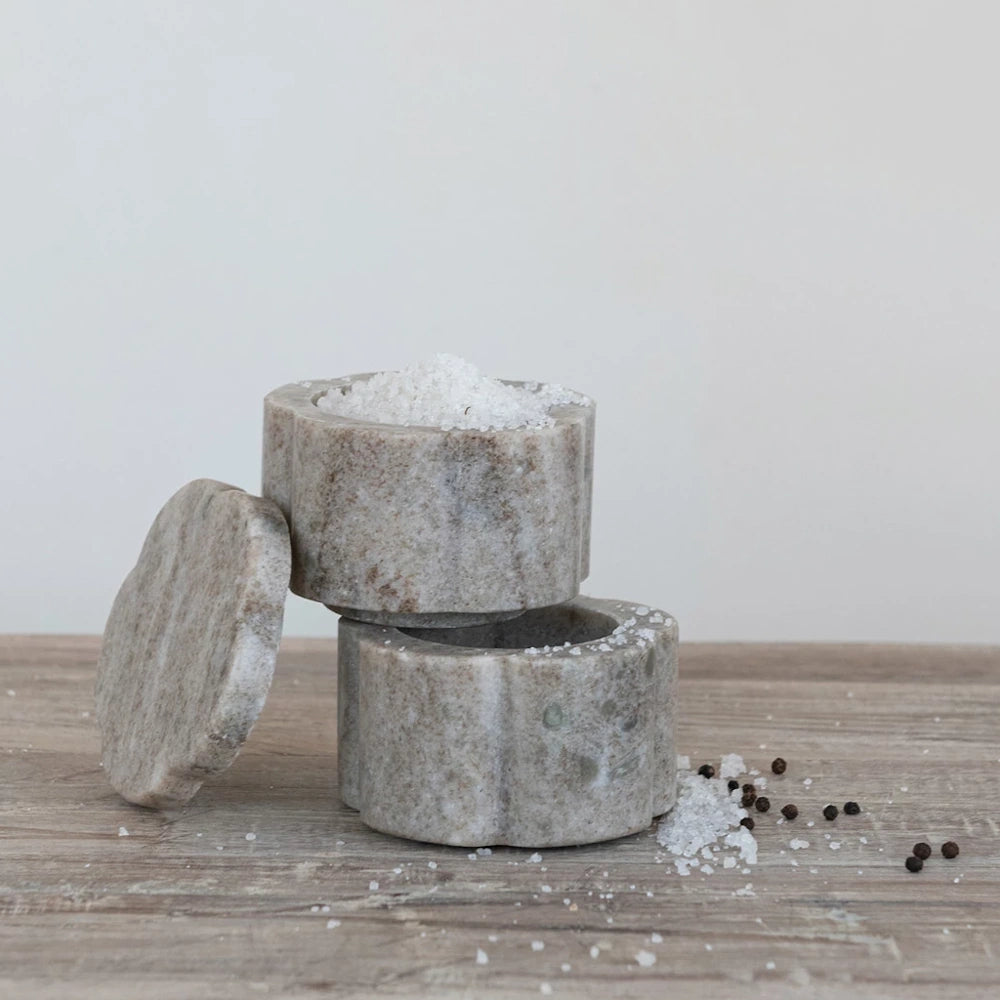 Grey marble salt cellar set and pinch pot with lid for kitchen countertop storage and seasoning.