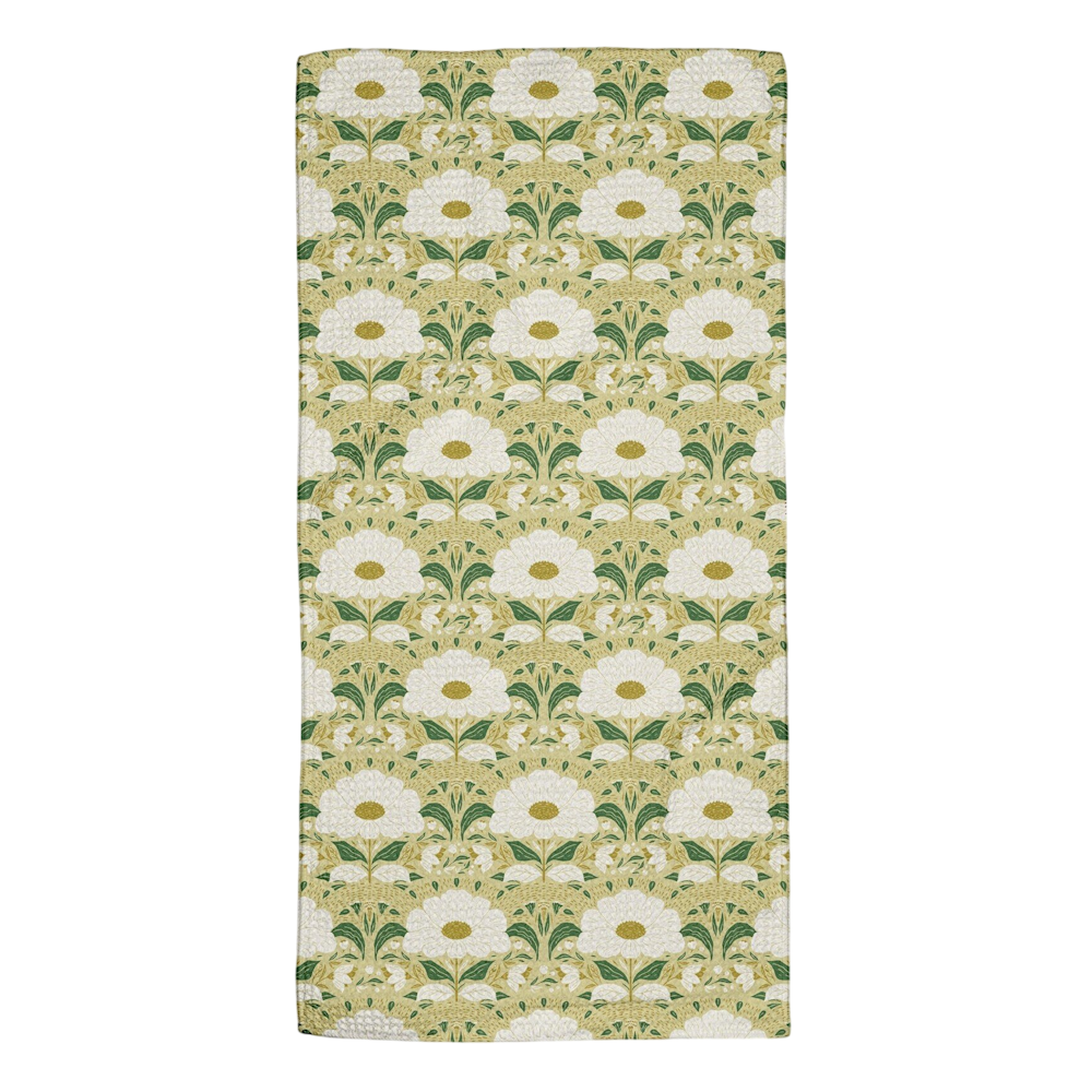 A rectangular towel with a repeating Art Nouveau pattern of white flowers and green leaves on a beige background.