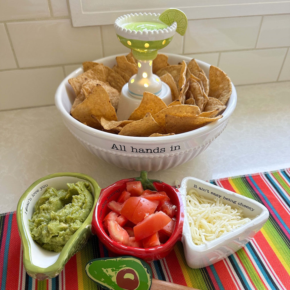 Ceramic chip and dip set with margarita light-up sitter, guacamole, salsa, and cheese in festive themed bowls.