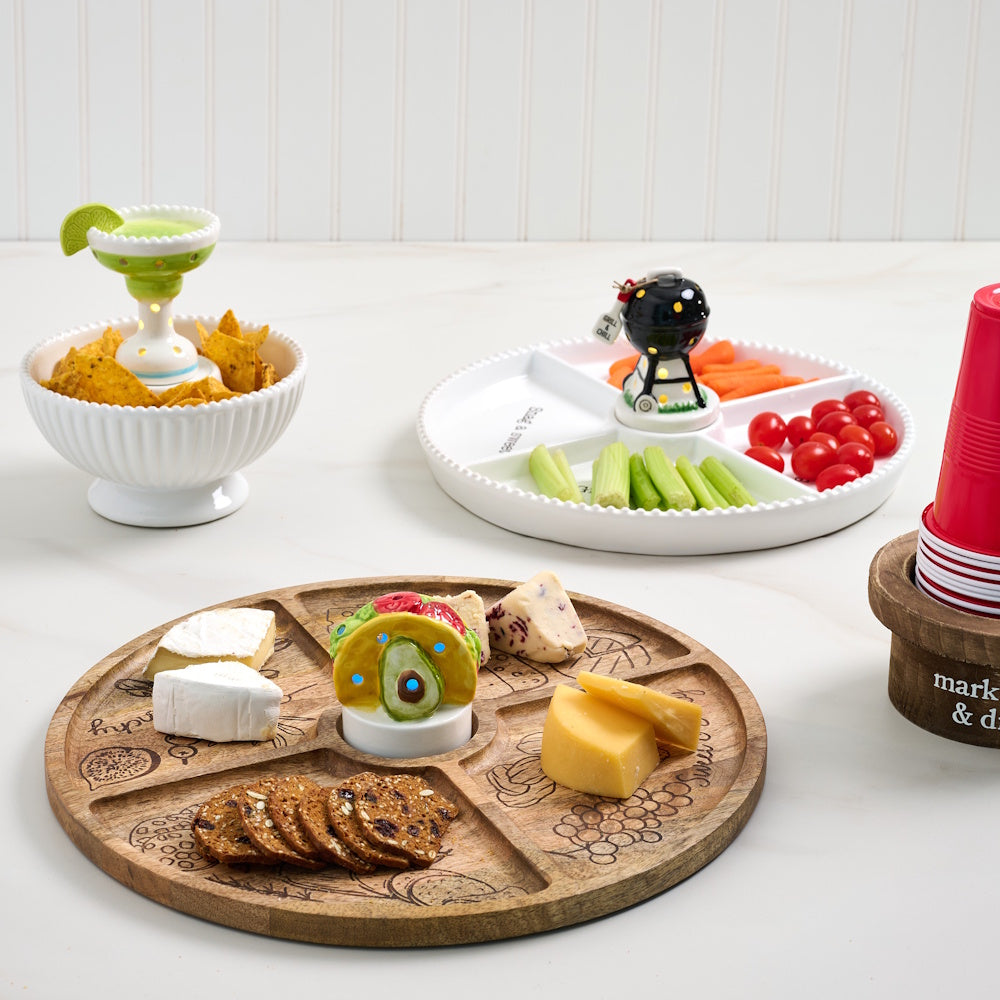 Party platters with cheese, crackers, and vegetables featuring decorative margarita, taco, and grill light-up sitters.