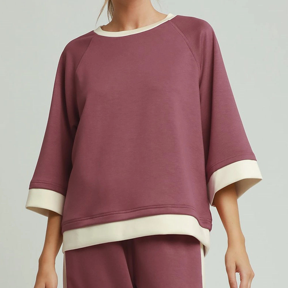 Marsala crewneck raglan pullover with wide three-quarter sleeves and contrast off-white trim.