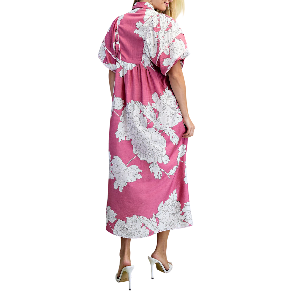 Back view of a woman in a mauve floral-print midi dress with short puff sleeves and white heels.