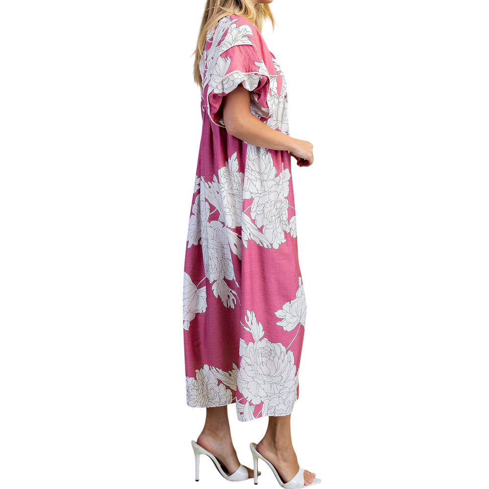 Side view of a woman wearing a mauve midi dress with white floral print, short puff sleeves, and heels.