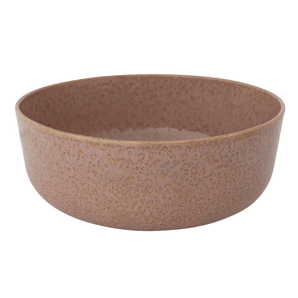 A mauve stoneware bowl with a heavily speckled, textured glaze against a white background.