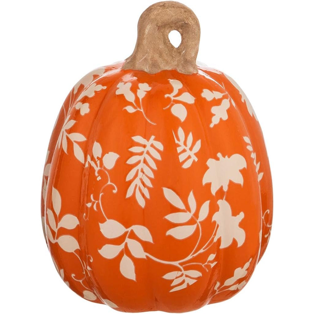Orange ceramic pumpkin decor with a tan stem and a white printed autumn leaves and floral pattern.