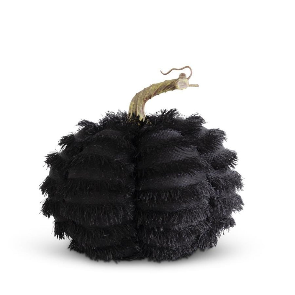 Black eyelash fringe fabric pumpkin with a curved rustic stem against a white background.