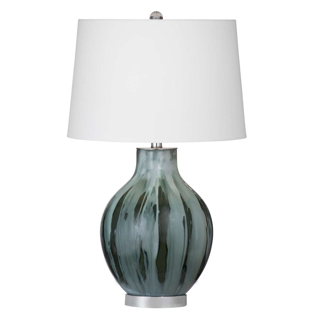 Modern table lamp featuring a marbled teal and grey glass base with a crisp white drum shade.