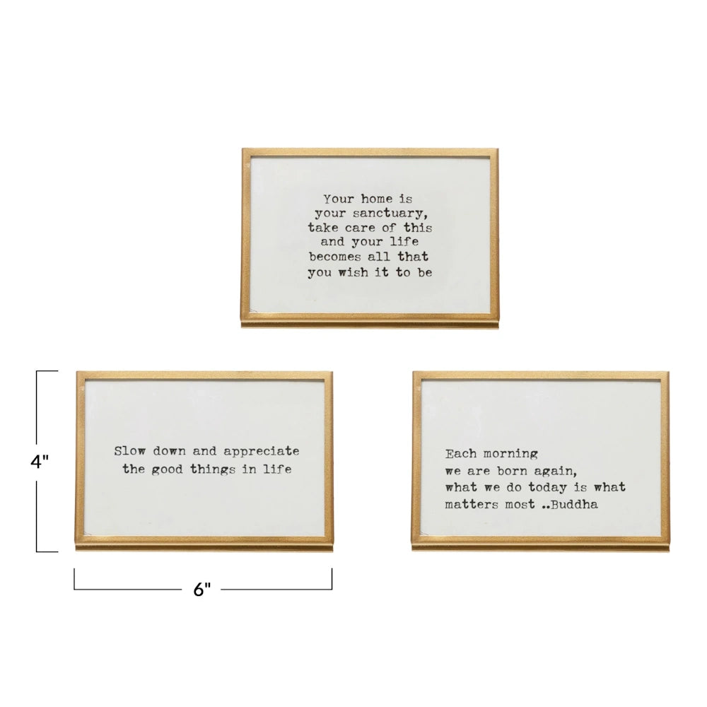 Set of three 4x6 inch gold metal frames with glass fronts and typewriter-font inspirational quotes on white backgrounds.