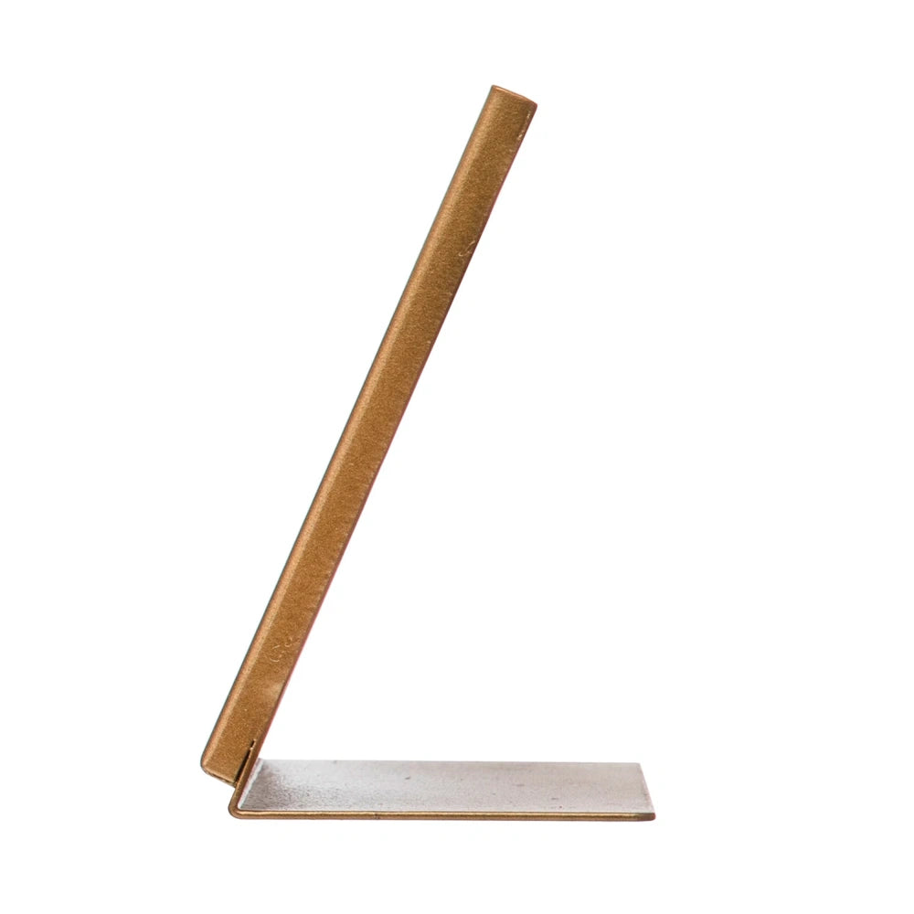 Side view of a modern gold metal easel picture frame with a minimalist L-shaped stand on a white background.