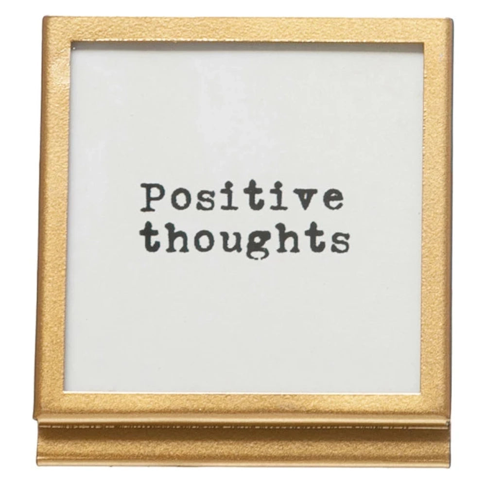 Gold square metal and glass easel frame featuring a typewriter-style "Positive thoughts" inspirational quote.