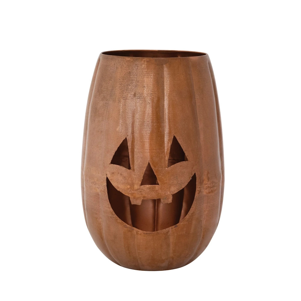 Bronze metal jack-o'-lantern candle holder with cutout face features.