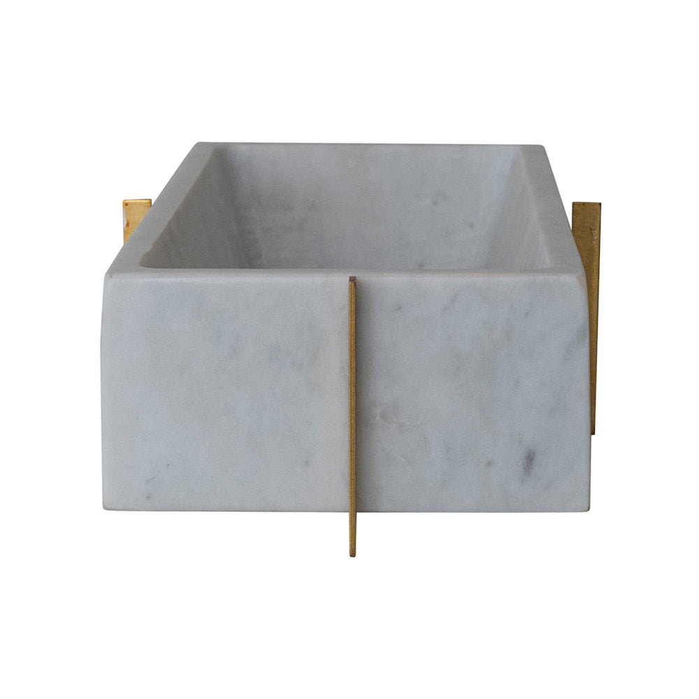 White marble rectangular container in a minimalist gold metal stand, modern home decor accessory.